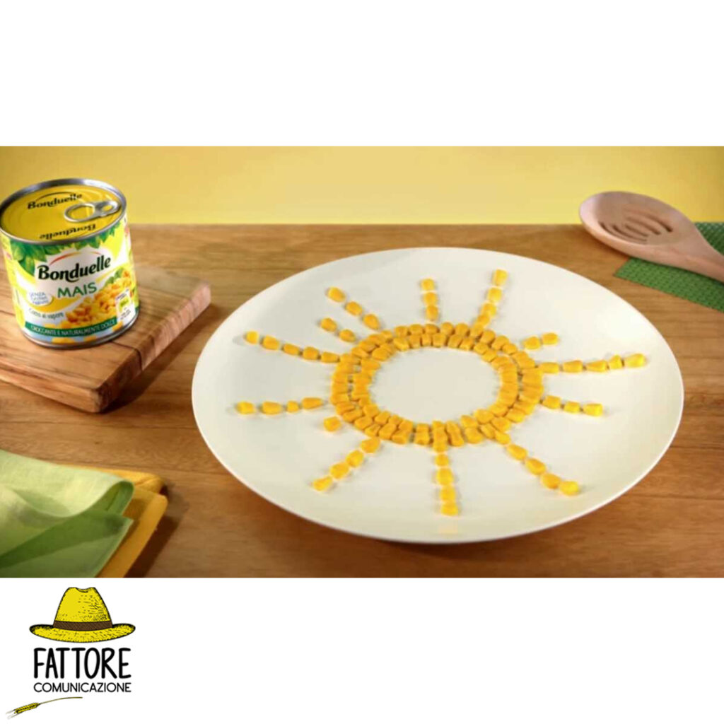 pubblicità bonduelle con chicchi di mais sul piatto